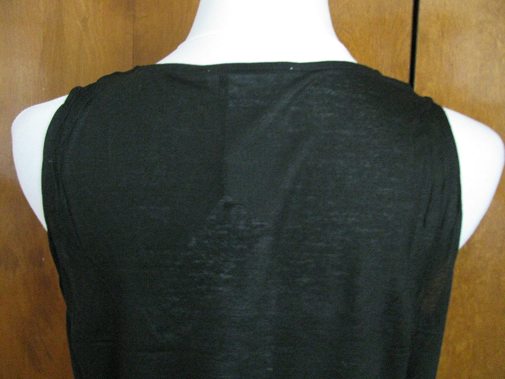 Lacoste women's black top runs big New