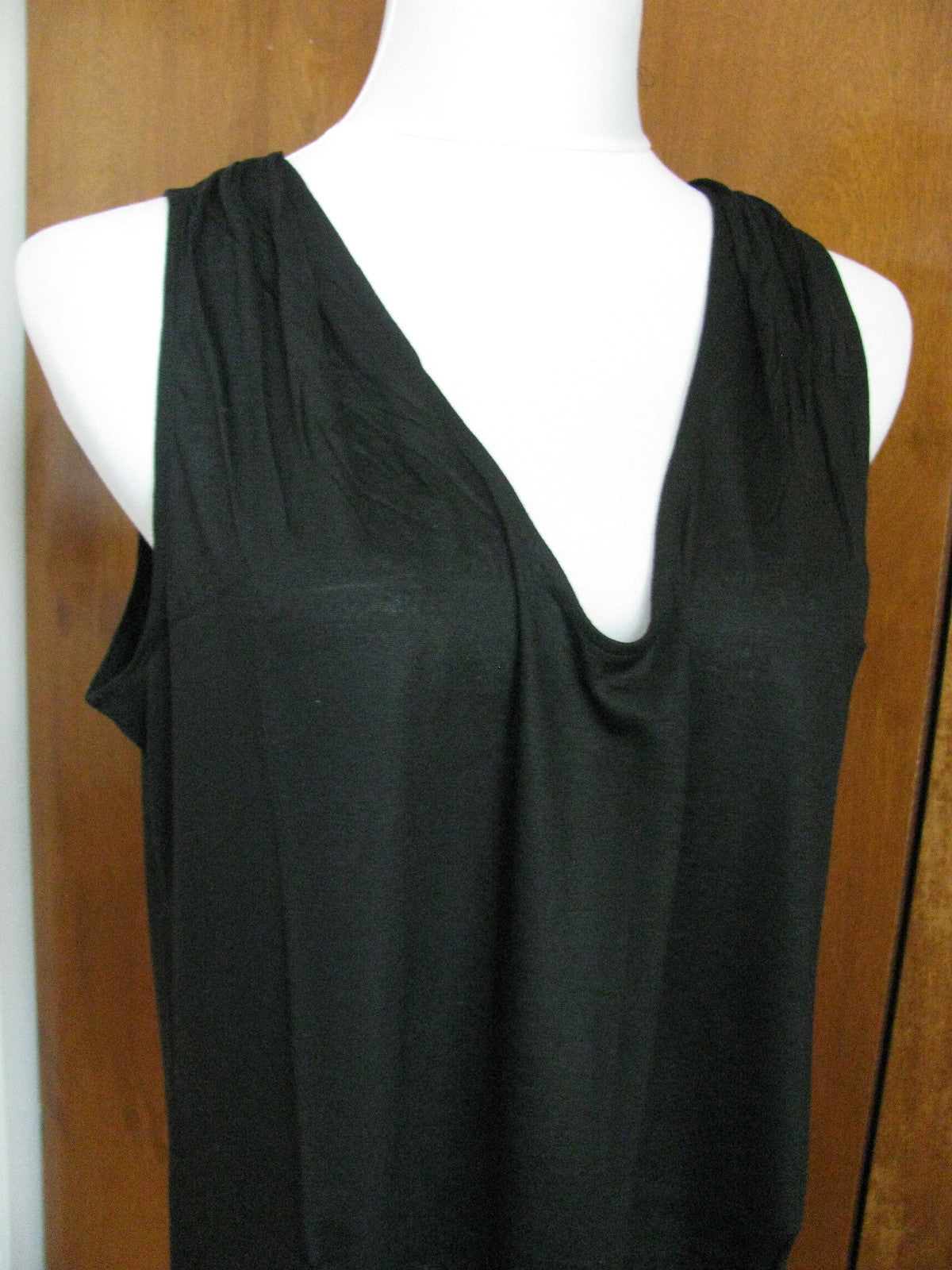 Lacoste women's black top runs big New
