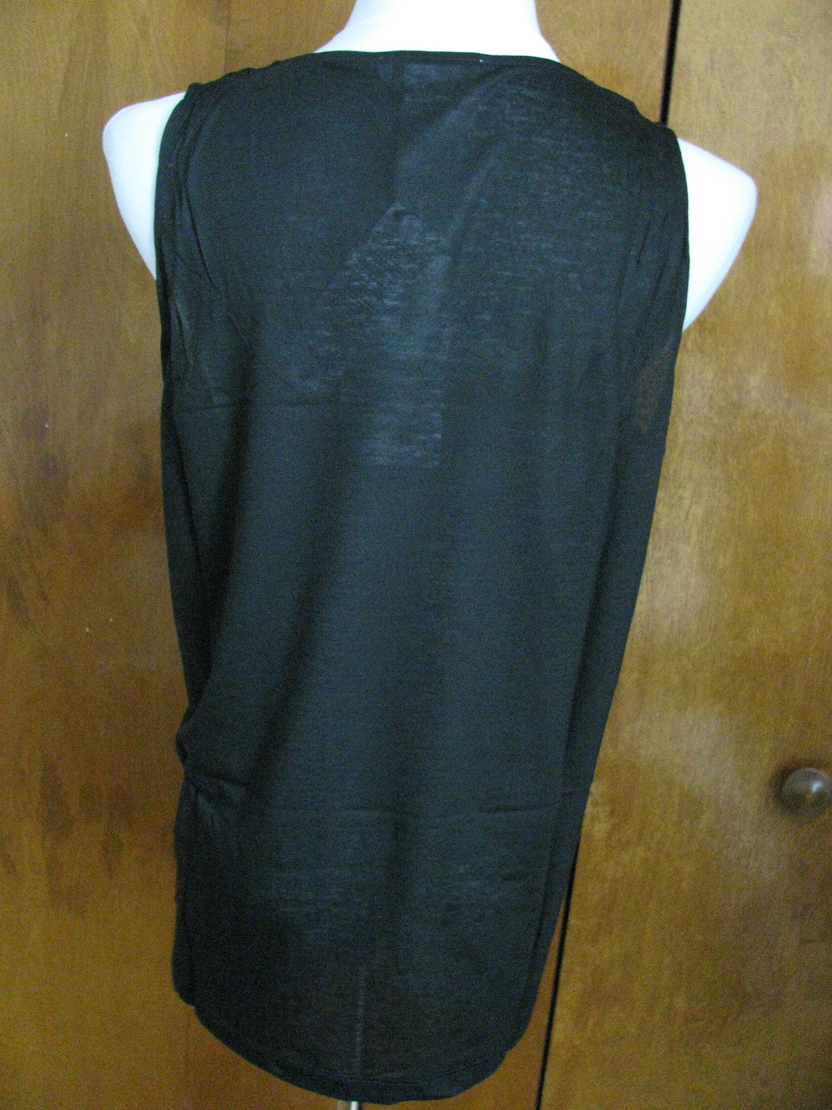 Lacoste women's black top runs big New