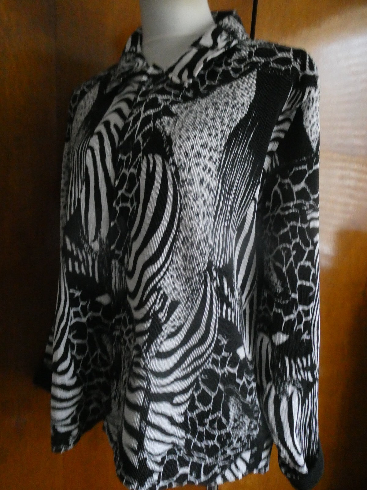 From Macys women's reversable black/white soft polyester blazer size 14 US