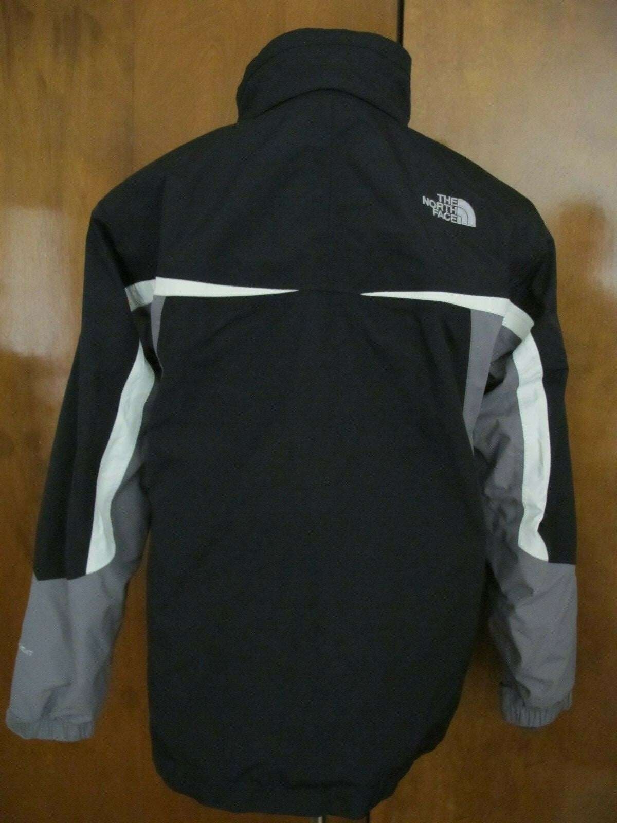The North Face black boys XL zip out fleece jacket can be worn 2 different ways