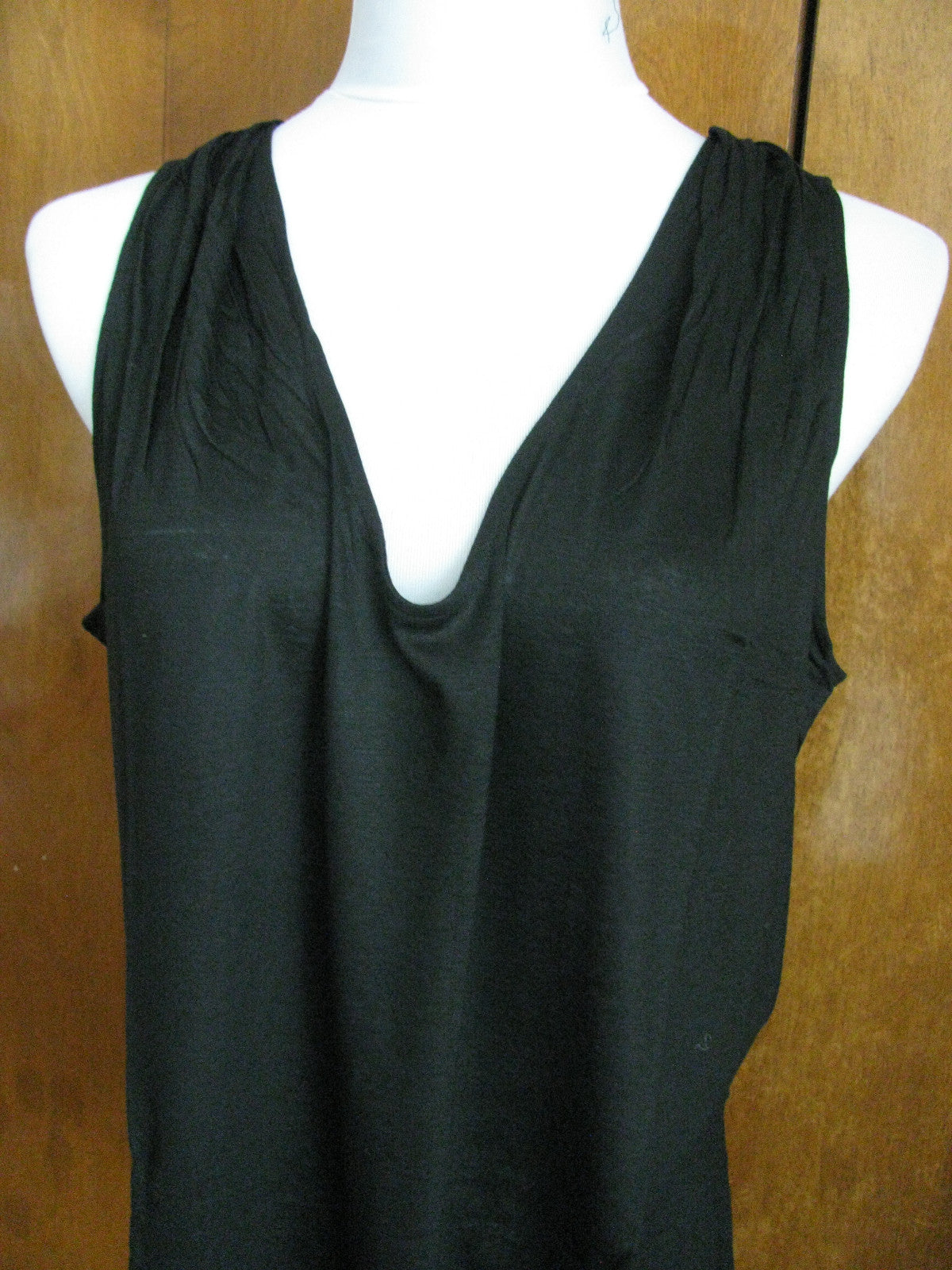 Lacoste women's black top runs big New