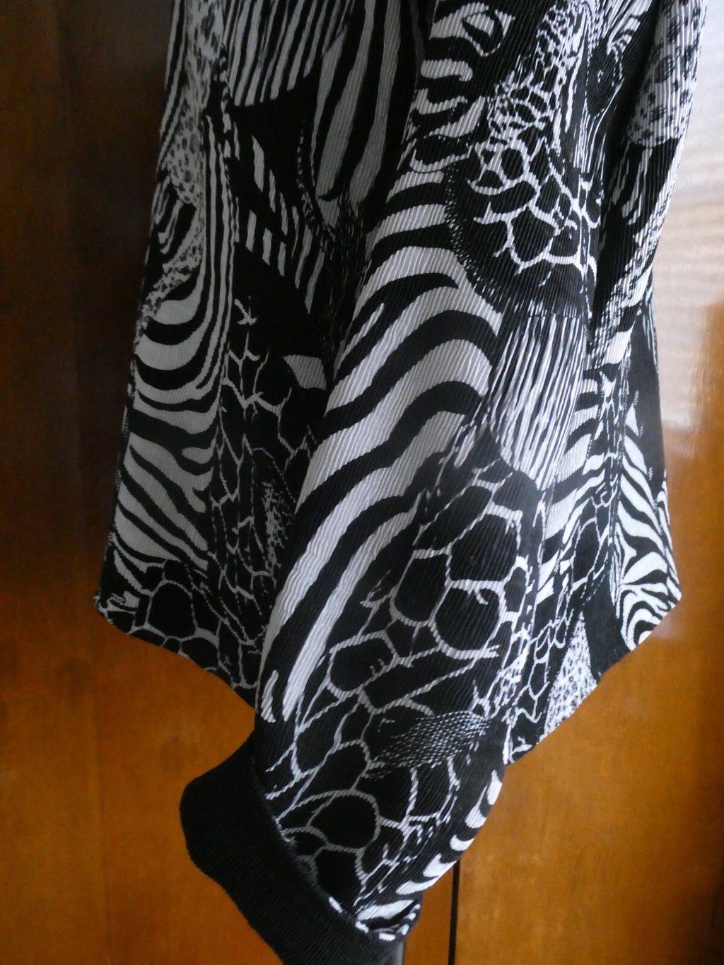 From Macys women's reversable black/white soft polyester blazer size 14 US