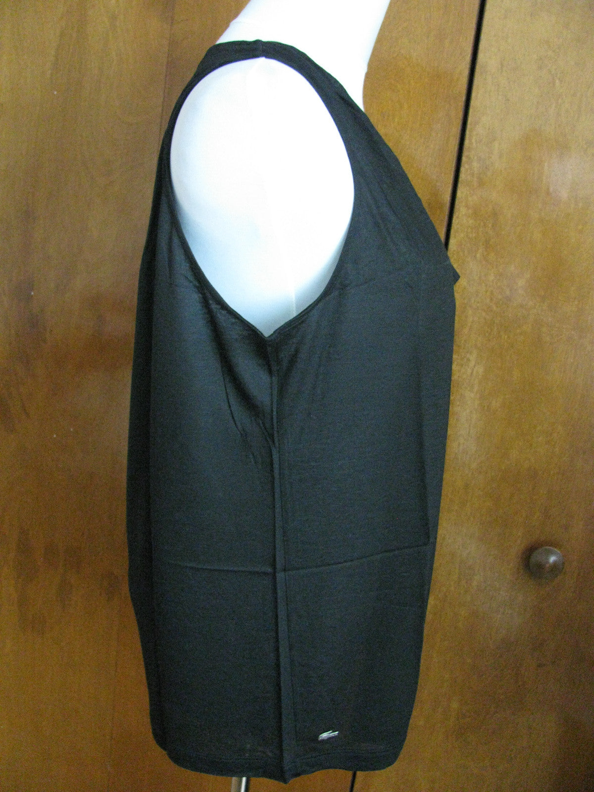Lacoste women's black top runs big New